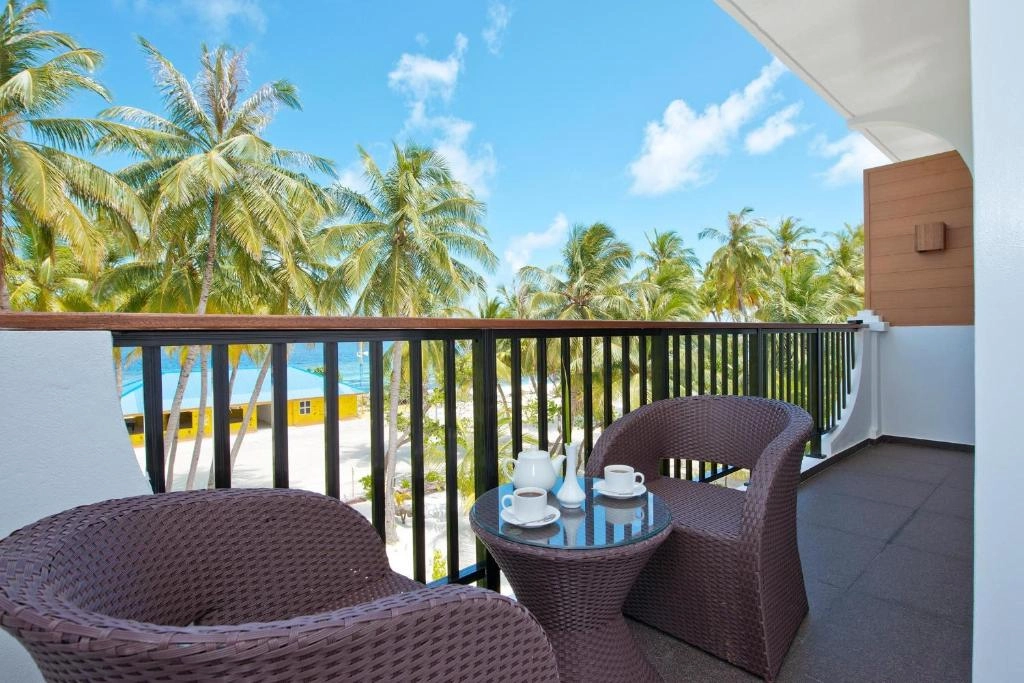 Private balcony with palm tree views at Crystal Sands